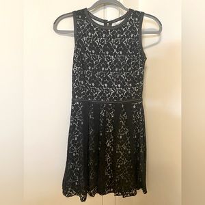 Sleeveless black lace dress